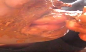 Teen boy rubbing crap on his face to eat it all