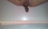 Blonde MILF spreading her legs while pooping