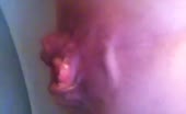 Blonde naked girl peeing in a bucket