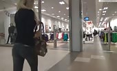 Sexy blonde babe peeing in mall