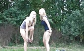 Two Swedish girls peeing outdoor on the ground