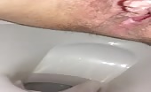 Sexy babe shitting in close up