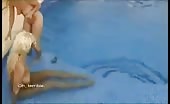 Two blonde girls are pooping in a pool