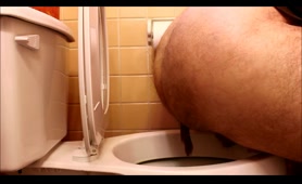 Hairy Man Squirts a Thick Stream into the Toilet