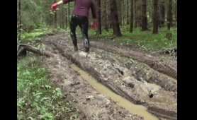 Man Squats in Mud and Pisses While Shitting
