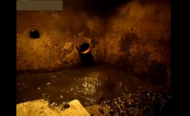 Man Squirts Shit into a Septic Tank Pipe