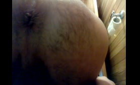 Woman dumps a nasty load on the toilet while pissing
