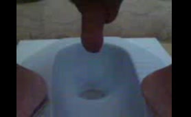 Nude Woman Presses Finger into Hole in Bathroom
