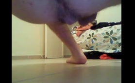 Nude Man Shits on Floor in Bedroom Close-Up