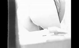 Nude Black and White Babe Pisses on a White Shelf