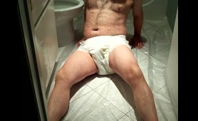 Man in Diaper Shits and Pisses on Floor Tiles