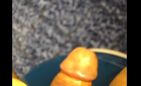 Blonde Man Squeezes His Penis with a Blue Bowl