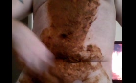 Tattooed Babe Smears Shit Over Her Tits and Belly in Bedroom