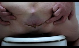 Lady Dumps a Nasty Load on the Toilet While Peeing