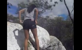 Sexy Babe Pees on the Rocks