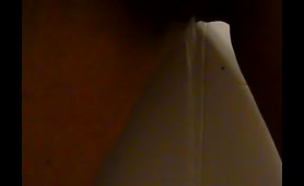 Woman Pees on the Wall
