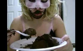Masked woman eats Shit from a plate